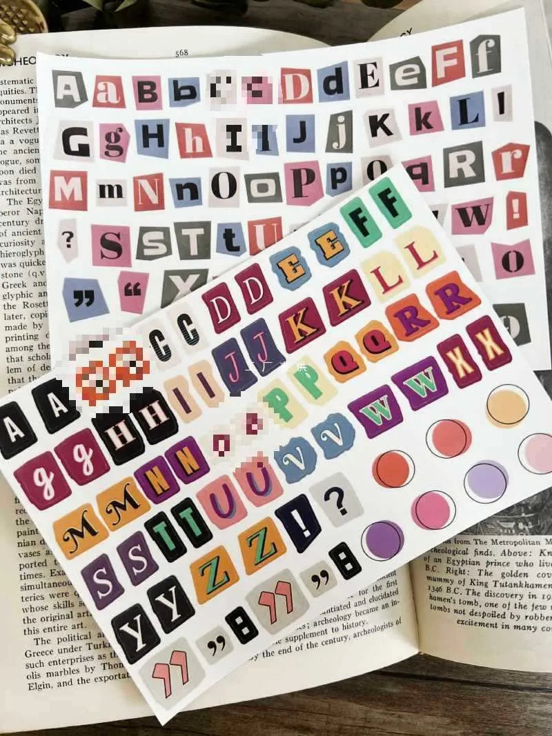 English letters and numbers symbol label stickers showing colour-coded letter sets A through E with weekly words