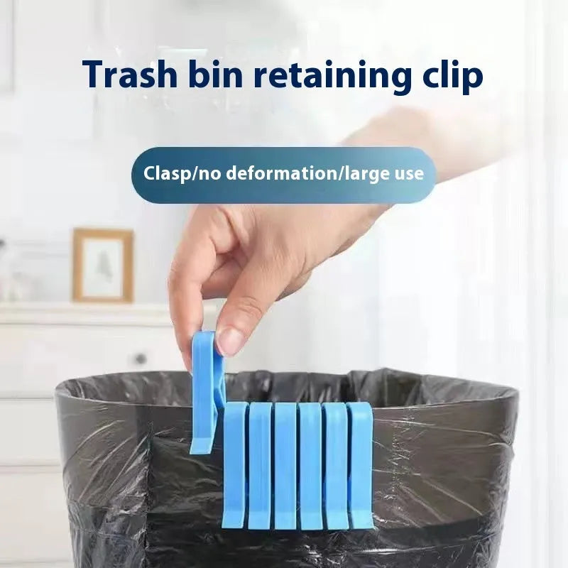 A white polypropylene garbage bag fixing clip holding a black bin liner to the rim of a metal trash can.
