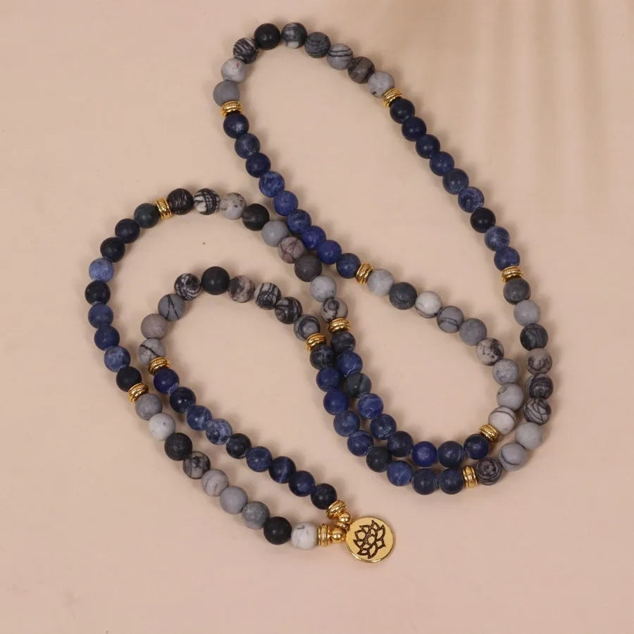 Multi-layer alloy women's bracelet with blue patterned network stone beads.