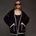 Lace-up front knitted cardigan in a loose fit, shown in black, camel, and white colour options.
