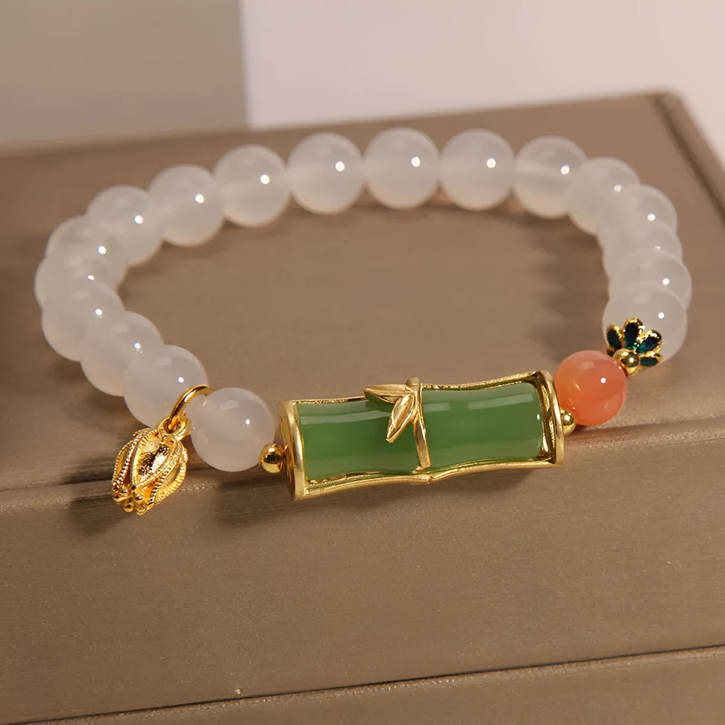 White agate and jade bamboo beaded bracelet on wrist, natural stone jewellery for women
