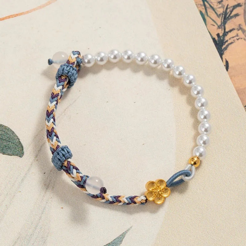 Colorful electroplated cord carrying strap with pearls and flowers and a sterling silver chalcedony charm