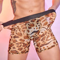Men's leopard print boxer shorts on flat surface showing animal print pattern