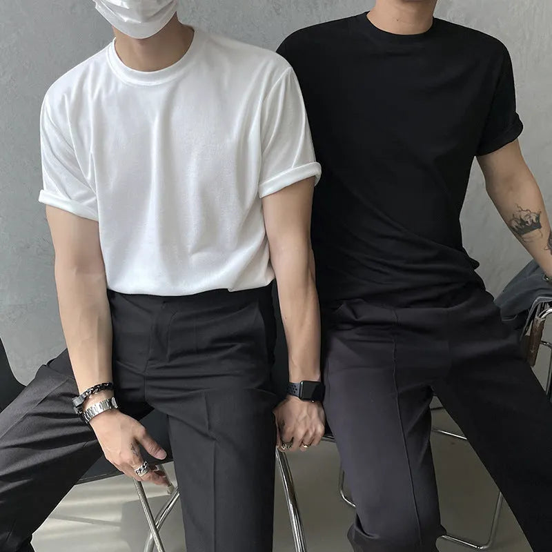 Mens slim fit cotton t-shirt in black on a hanger, showing round neck and half sleeves.