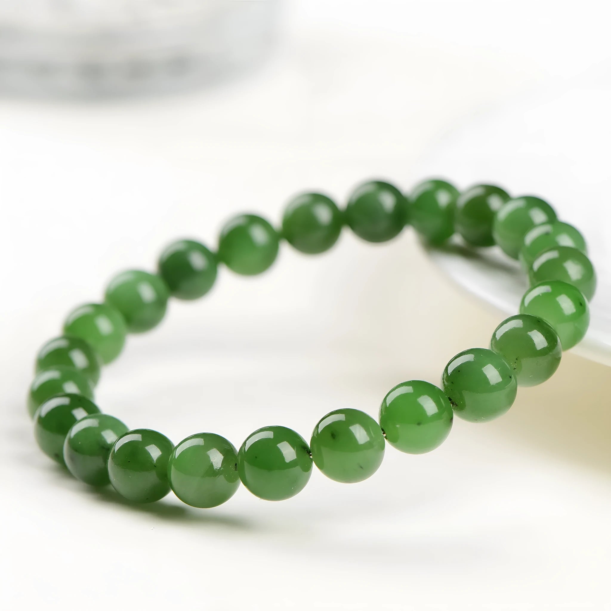 Natural Hetian jade jasper ball bracelet with polished beads, shown in multiple bead size options.