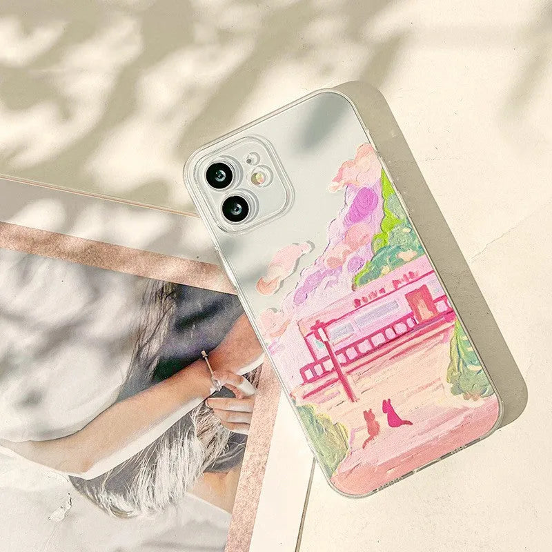 Soft silicone iPhone case showing colourful cartoon illustration of two cats on the back