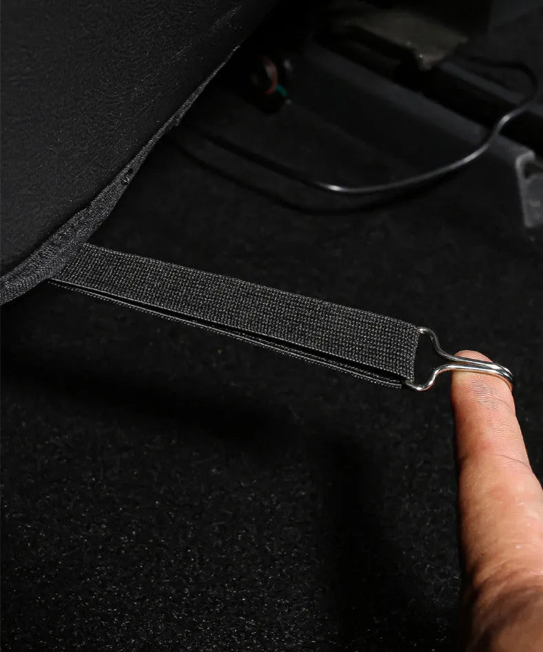 Black leather motorcycle anti kick pad with storage pocket, shown alongside a second pad