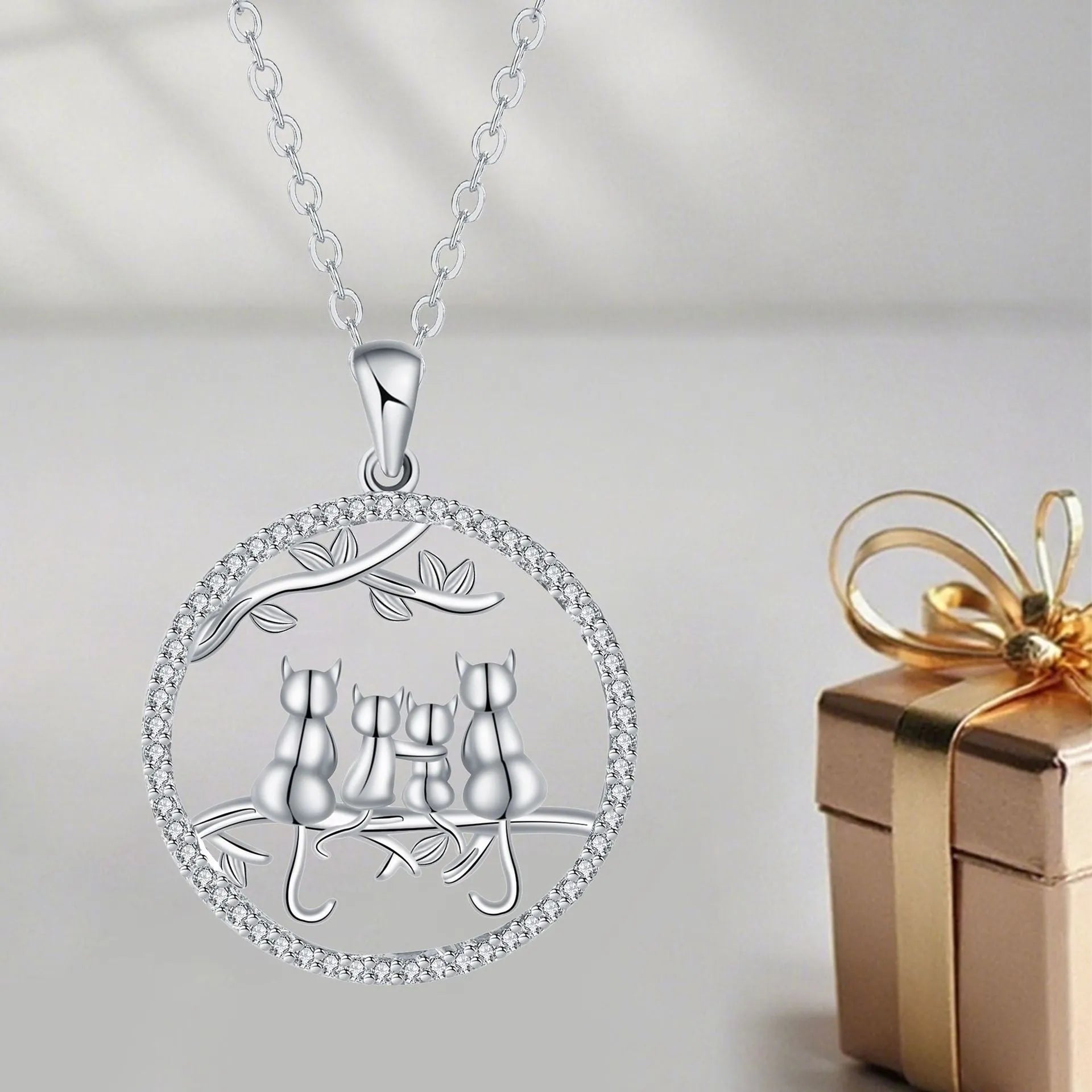 Copper Four Kitten Necklace with cross chain, electroplated finish, original cat design.