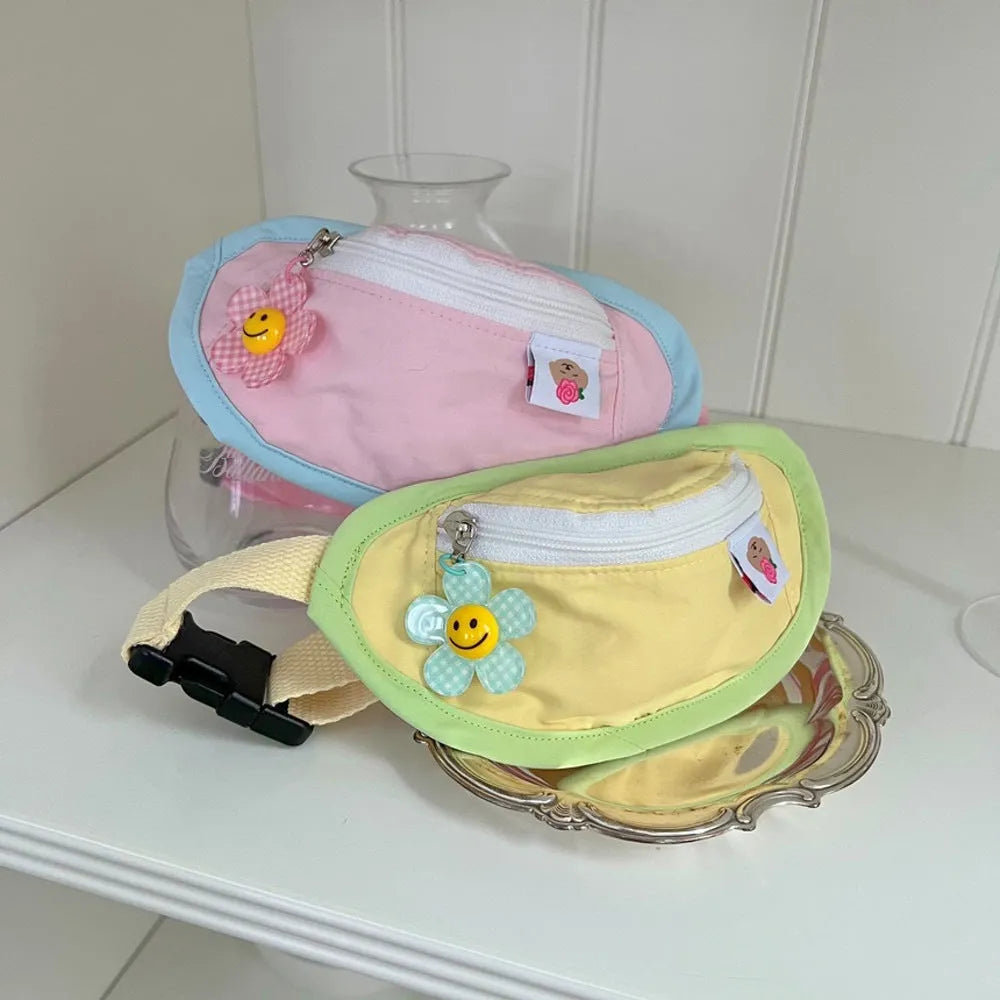 Pink and yellow backpack-style carrier bag for a small dog or cat on a person's back.