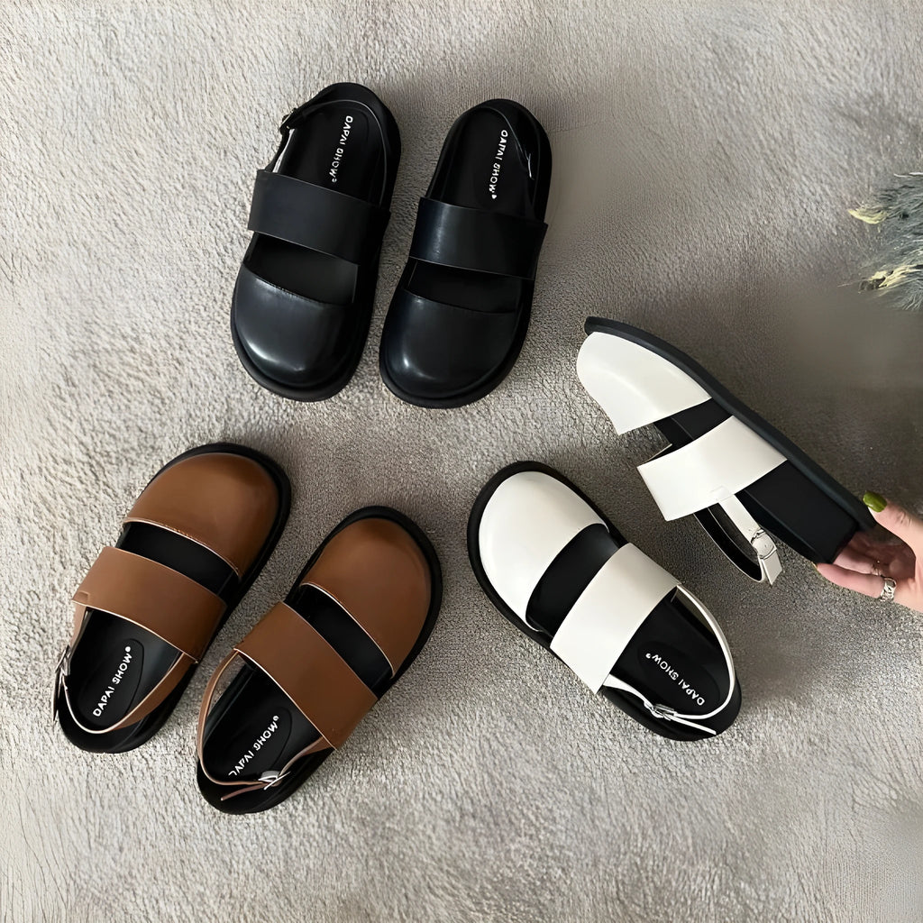 Women's retro sandals with a single ankle strap buckle and closed round toe, shown in apricot colour.