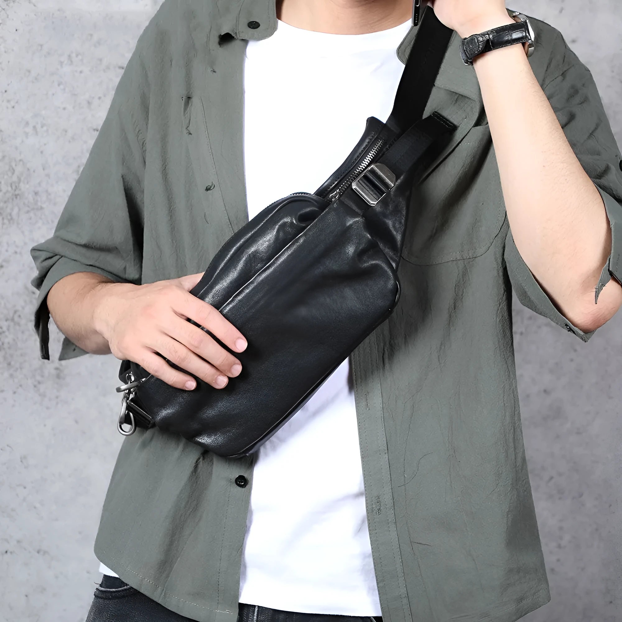 Men's small black head layer cowhide cross-body backpack with zip closure and single shoulder strap