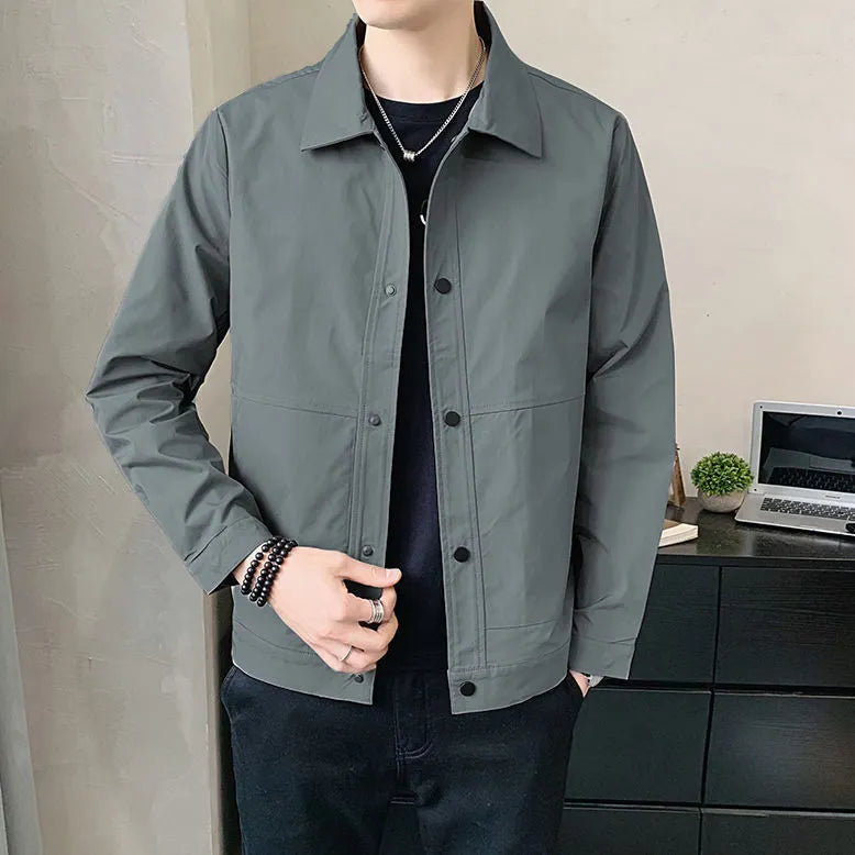 Men's Korean style thin single layer jacket in grey tones, with long sleeves, shown on a hanger.