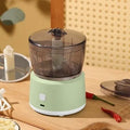 Mini meat grinder with transparent cup body, stainless steel blade, and USB rechargeable port in white colour