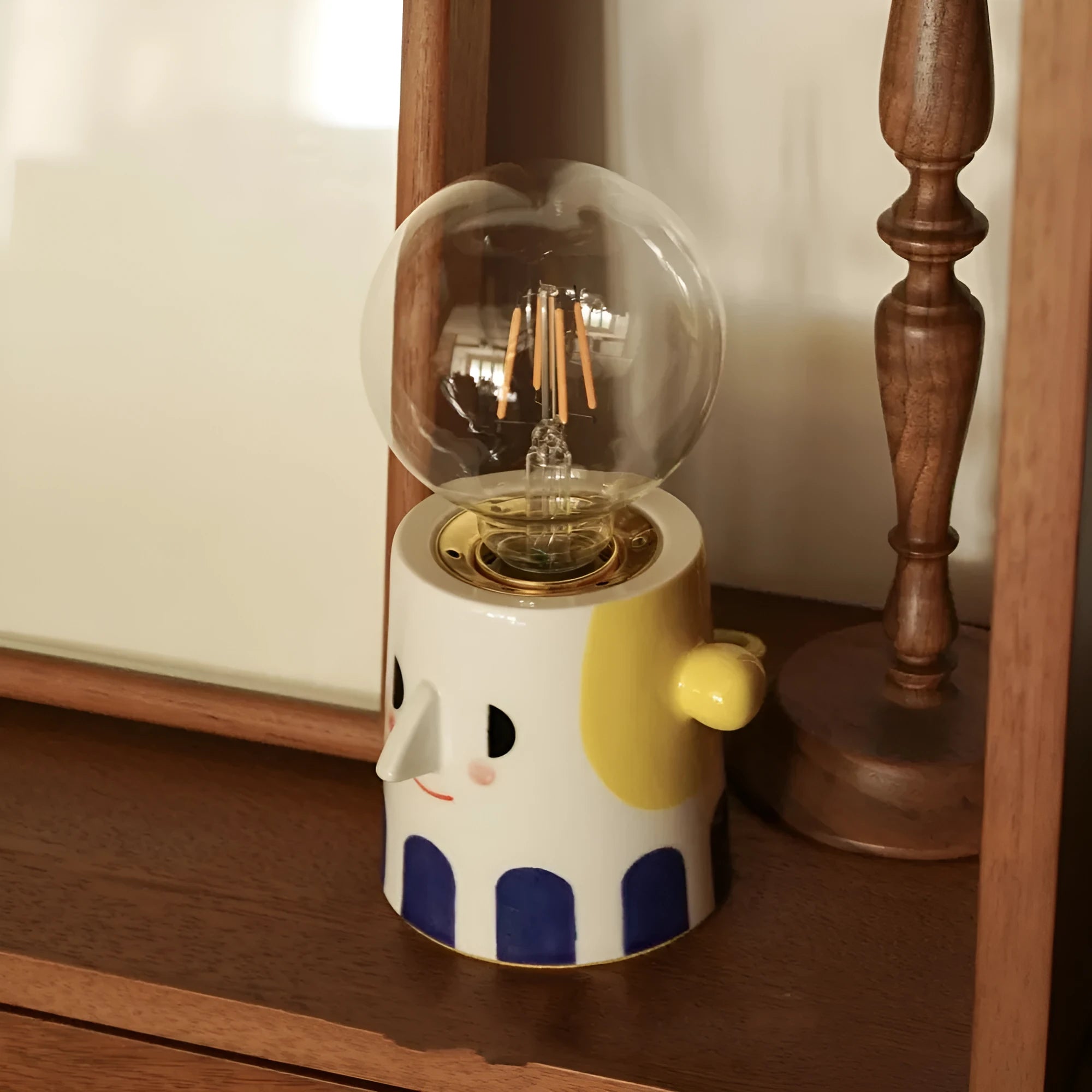 Handmade ceramic spherical ball headlight lamp on bedside table