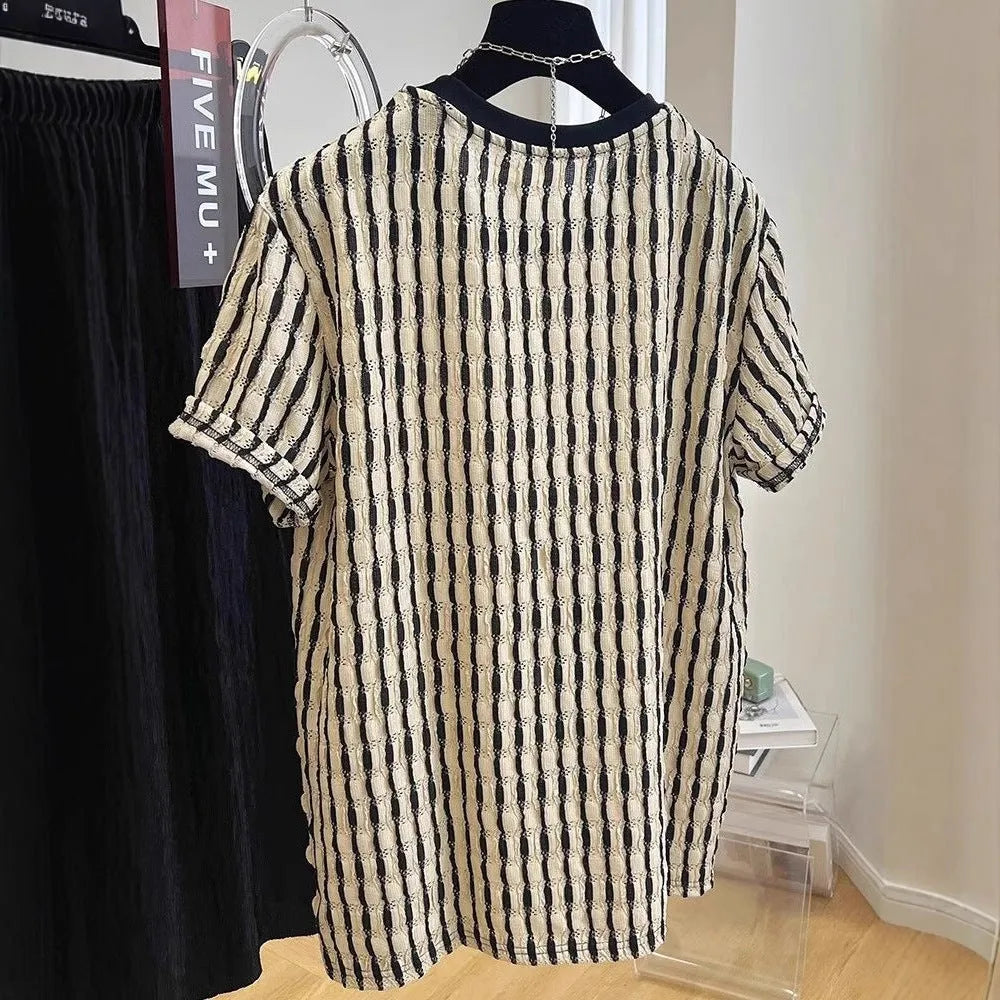 Men's black striped casual shirt with loose fit and short sleeves on hanger