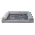 Breathable square sponge dog bed for pets in blue colour, shown in a home setting.