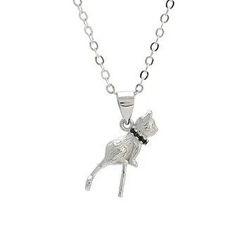 Close-up of a sterling silver cat pendant on a delicate clavicle chain necklace.
