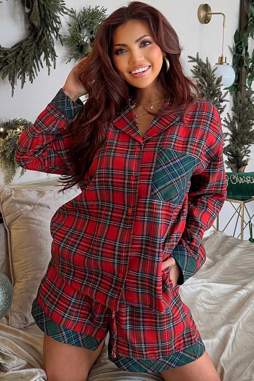 Red Christmas holiday pajama set with plaid patch detail on the long sleeve shirt and matching shorts.