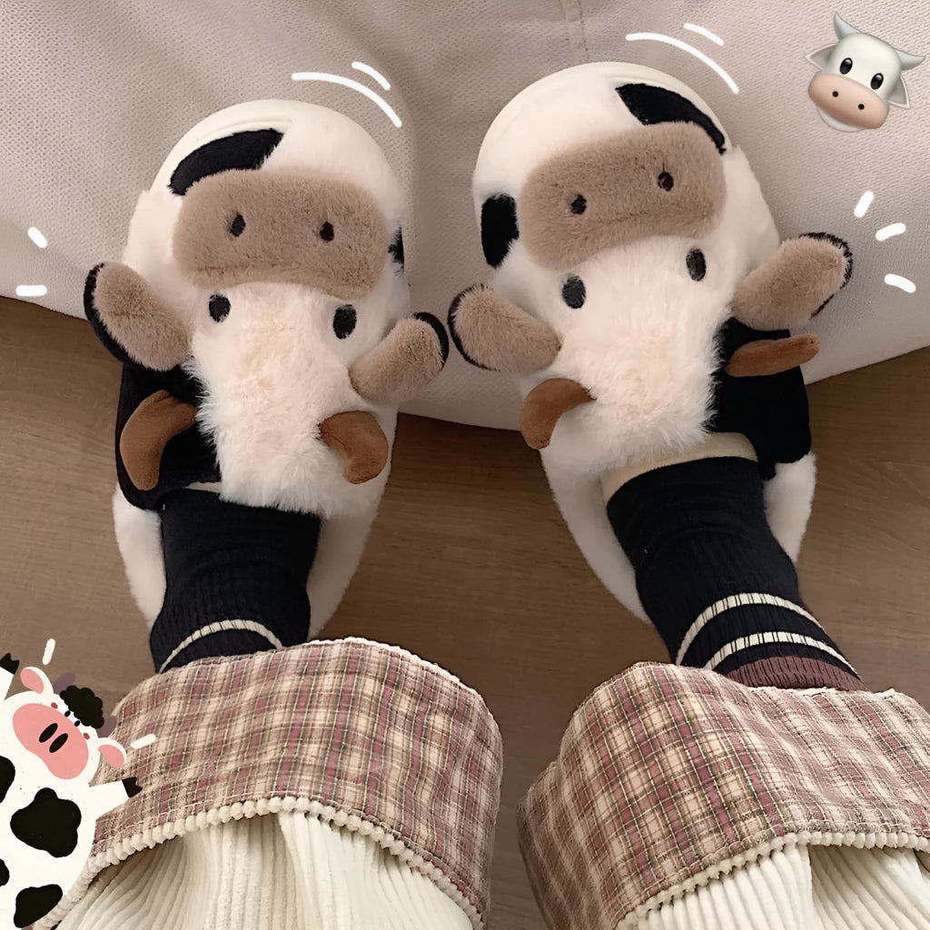 White cartoon cow slippers for women with fluffy faux fur and a textured non-slip sole.