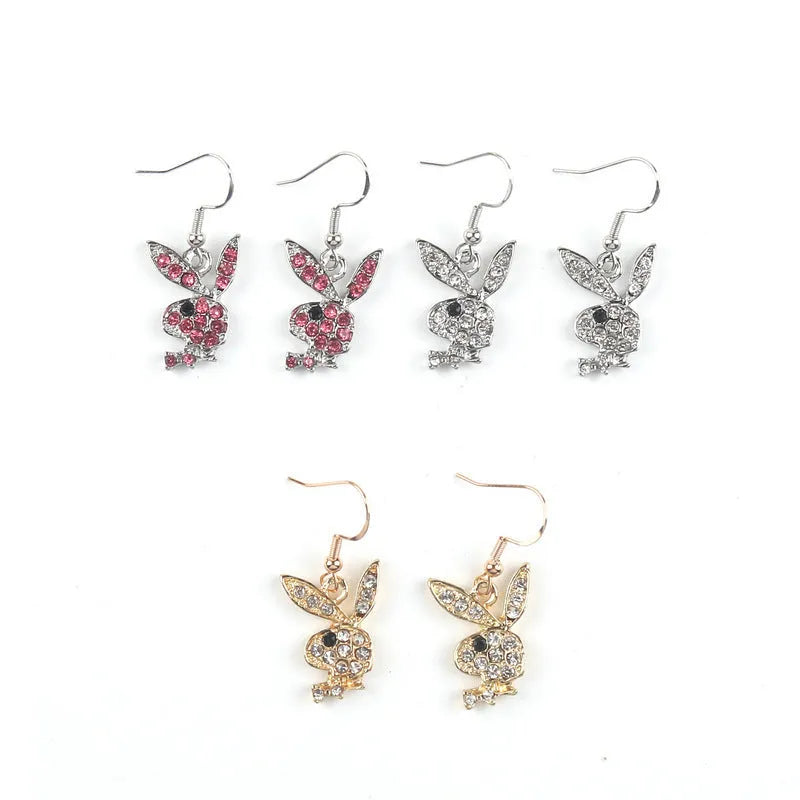 A pair of cute cartoon rabbit stud earrings for women in silver, pink, or gold colour.