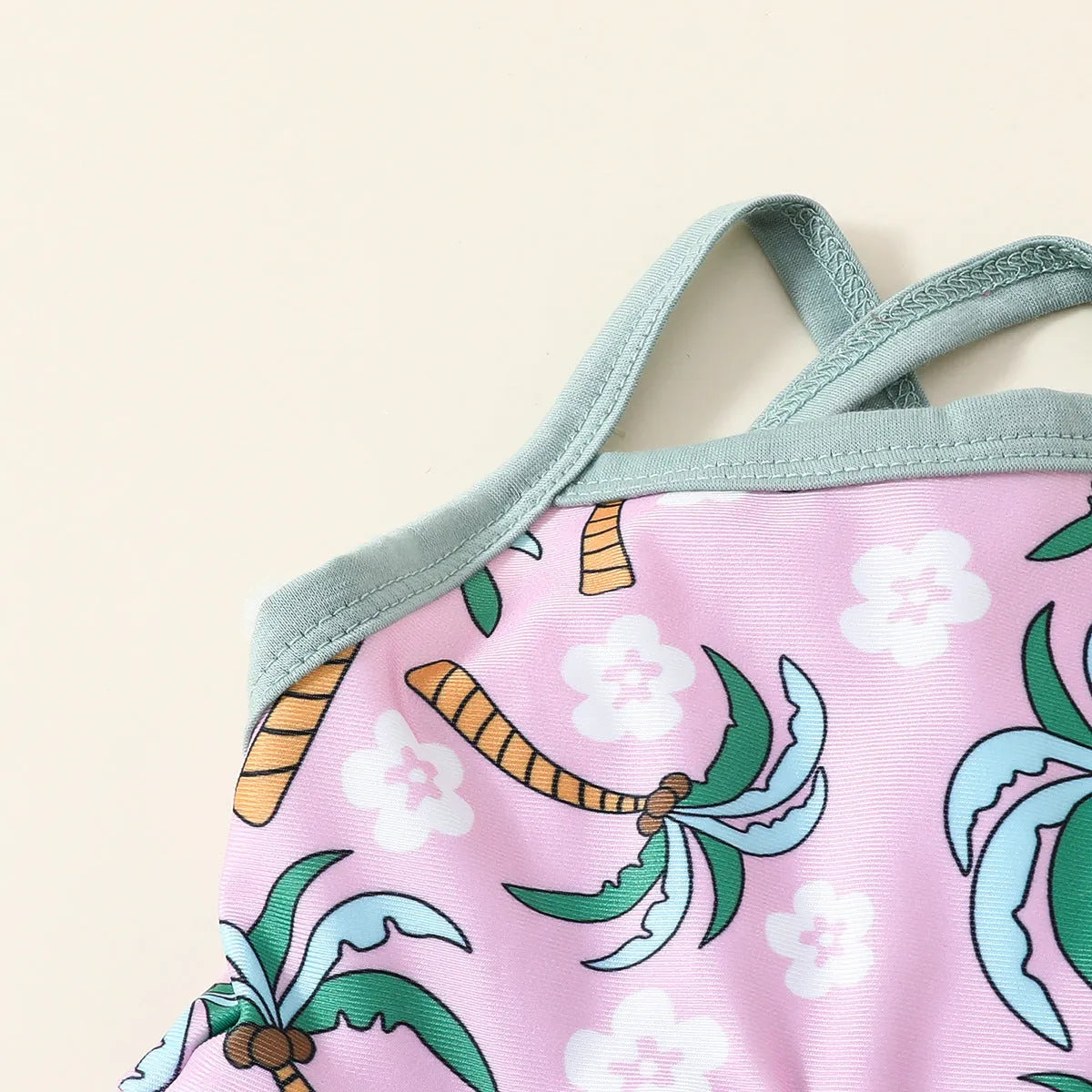 White children's two-piece swimsuit set comprising a top and shorts made from polyester.