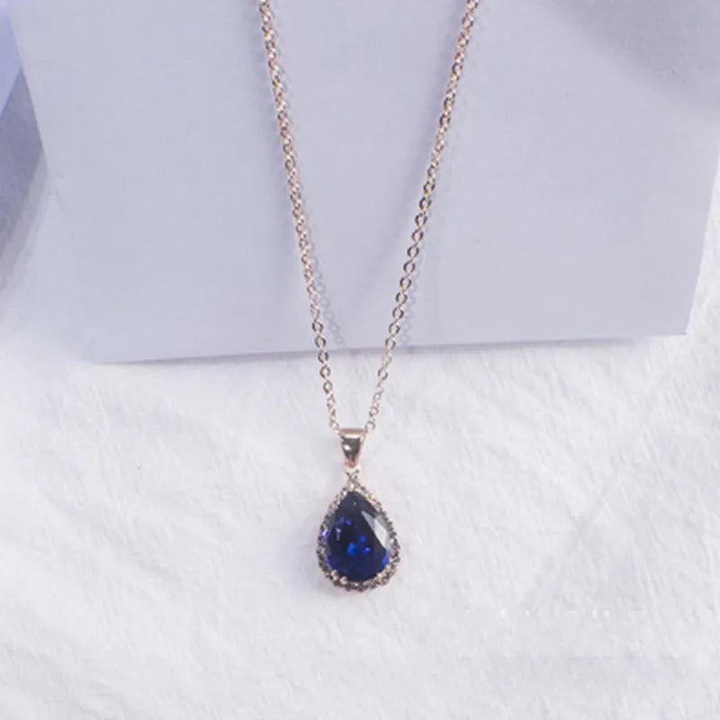 Women's rose gold drop shape necklace with rhinestone details on an alloy chain.