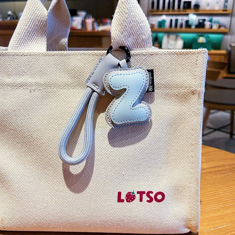 Leather keychain with letter O clip on a metal keyring, personalisation initial charm