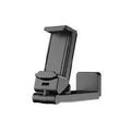 Foldable rotating universal phone holder in black, green, and grey colours on a desk.