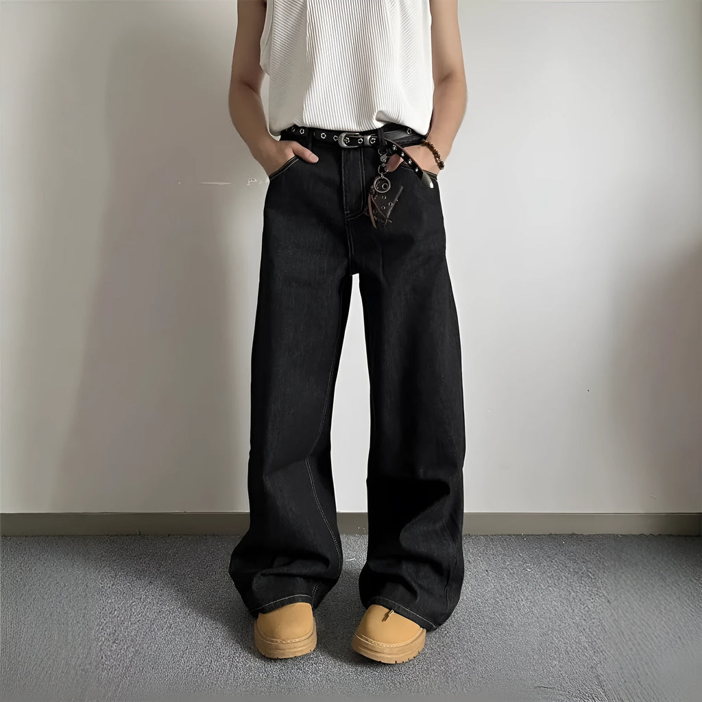 Black retro straight-leg jeans with wide-leg design on hanger