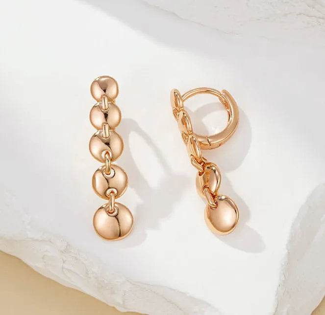 Retro long round circle earrings with woven copper construction and gold finish
