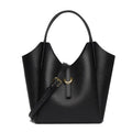 Genuine leather women's hand holding bucket bag in European American retro style with visible sewing thread detailing
