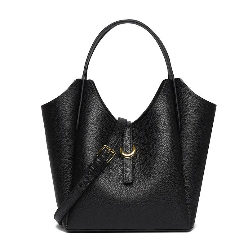 Genuine leather women's hand holding bucket bag in European American retro style with visible sewing thread detailing