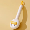 Small yellow duck-shaped pet grooming comb with needle head for hair removal on cats and dogs.