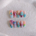 Handmade 3D flower and butterfly nail art sculptures in colourful press-on manicure designs