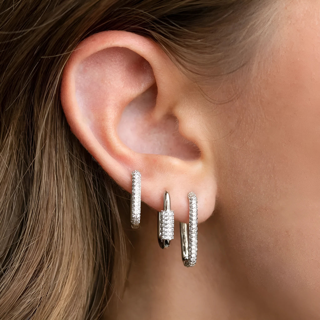 Three geometric earrings with micro inlaid zircon on square clips in gold and white finishes