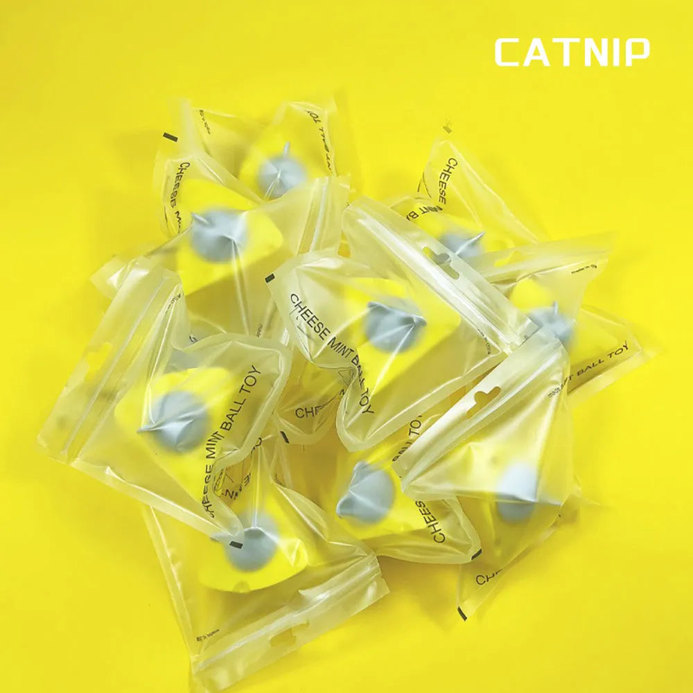 Yellow edible catnip and silvervine toy balls for indoor cat teeth cleaning and play