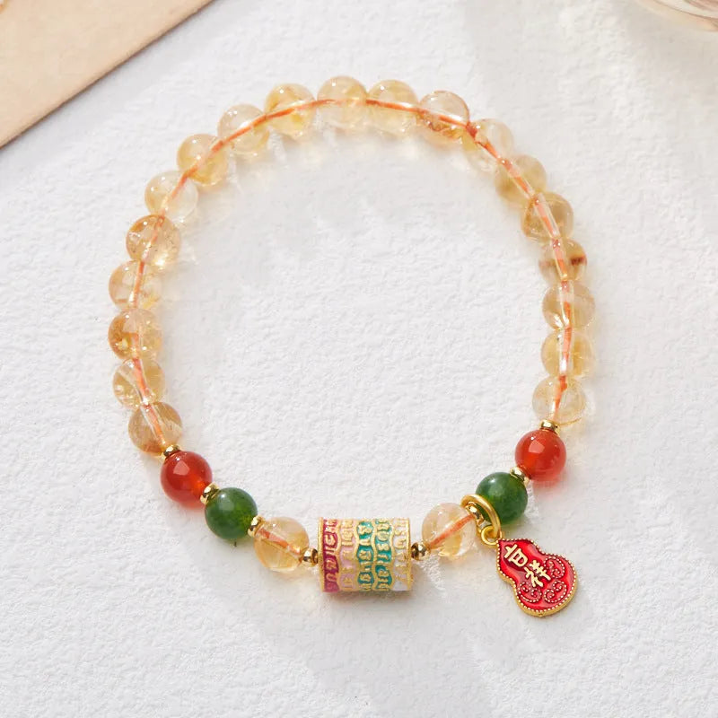 Citrine five sutra hand-woven crystal bracelet with geometric design on neutral background