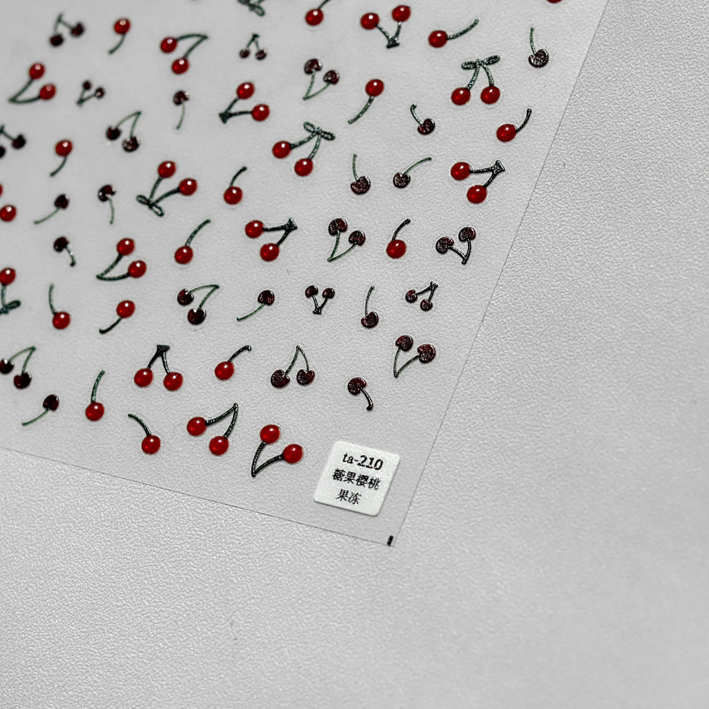 Jelly nail art sticker sheet with multiple cartoon cherry designs on a clear plastic backing