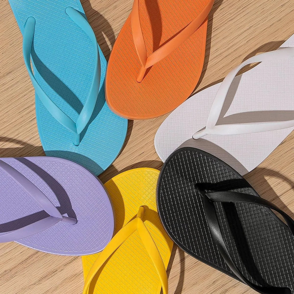 Foldable plastic beach slippers with hollow-out design and non-slip PVC soles in multiple colour options