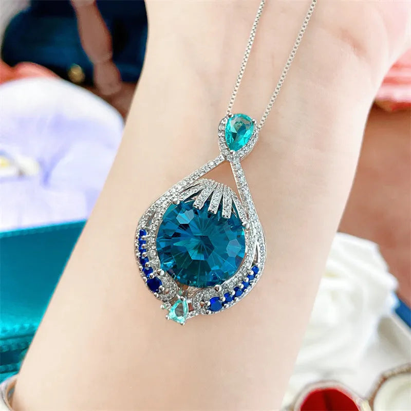 Blue geometric women's necklace with fireworks cut pendant on water wave chain
