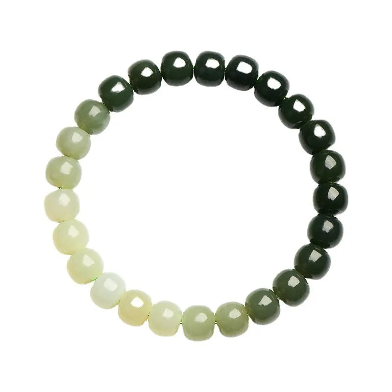 Natural Hetian jade bracelet with clear water gradient on wrist.