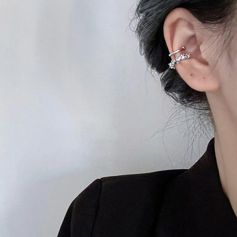 Pair of geometric irregular-shaped clip-on earrings with a frosty metallic finish.