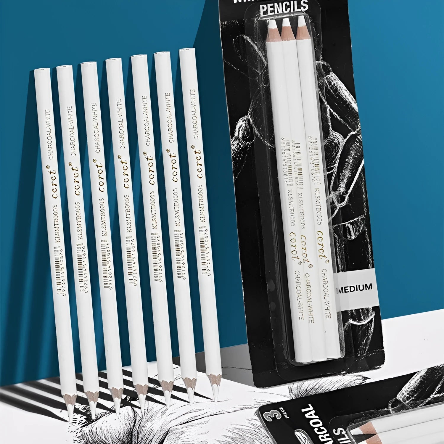 White charcoal pencil highlighting pen with wooden shell showing three pencils in packaging