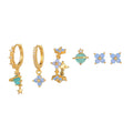 Gold and silver Japanese Korean style flower earrings studs with blue zircon mosaic detail.