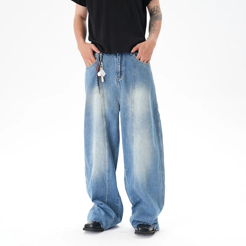 Light blue vintage washed wide leg machete jeans with zip fly on a model
