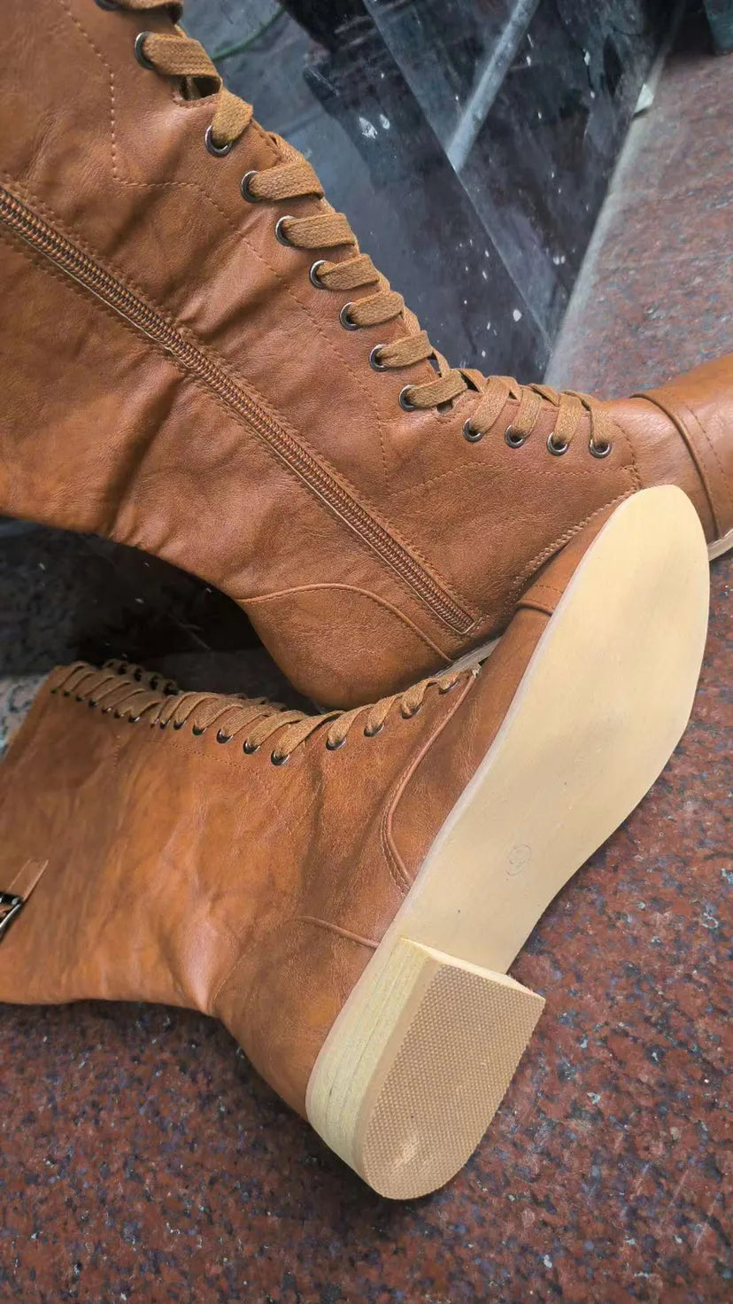 Women's black artificial PU knight boots with cross strap and lace-up closure on a size label.