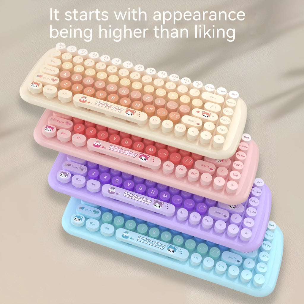 Candy pink wireless keyboard and mouse set with compact design on a desk.