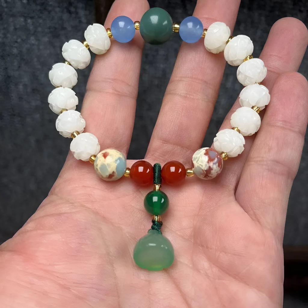 Hand-carved bodhi root bracelet with pumpkin lotus beads, white jade accents, and cat claw pendant