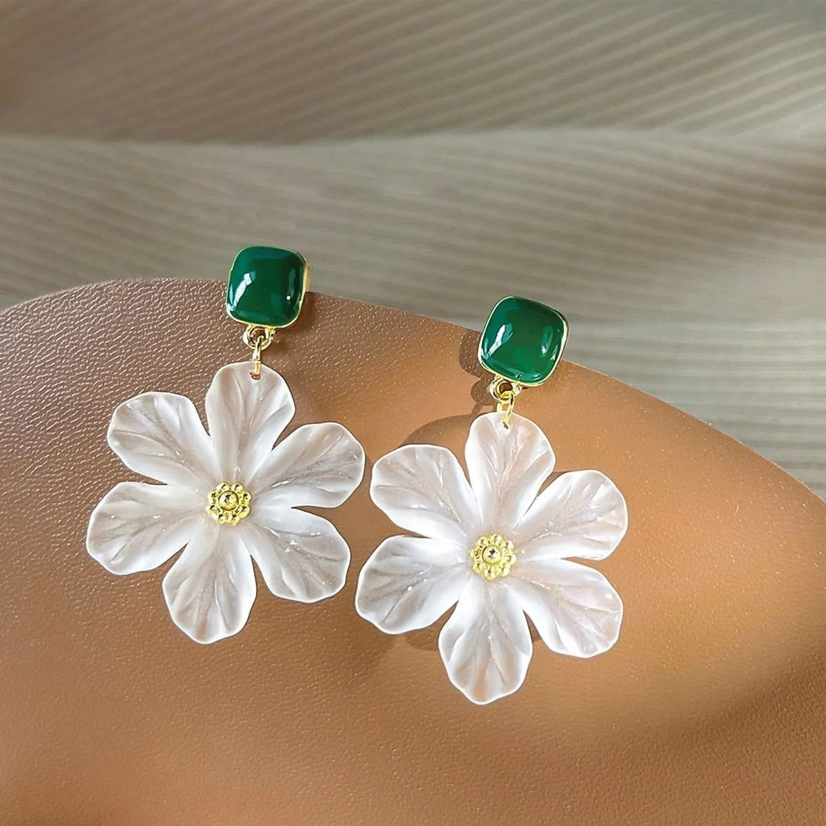 Dark green floral drop earrings with alloy construction and sterling silver fastening