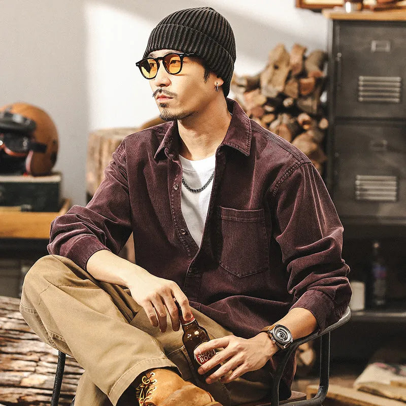Man wearing a red loose-fit corduroy long sleeve shirt, retro casual style.